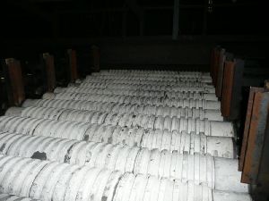 Coke grill separator with wear resistant ceramics shafts